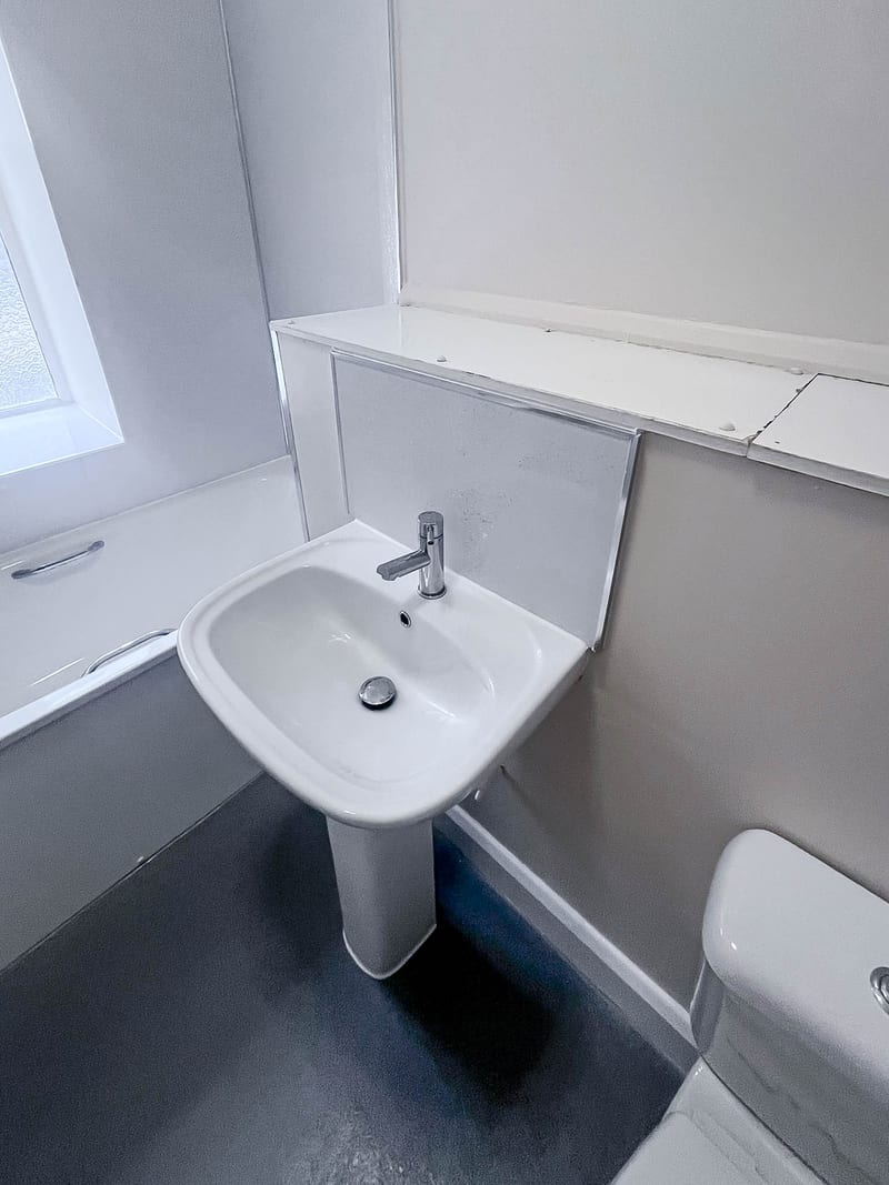 The same bathroom, the basin and WC corner, after the works