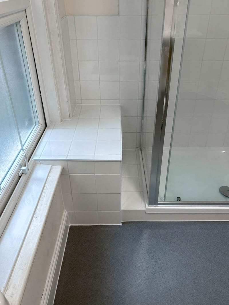 A second property, the bath below the window, after the works