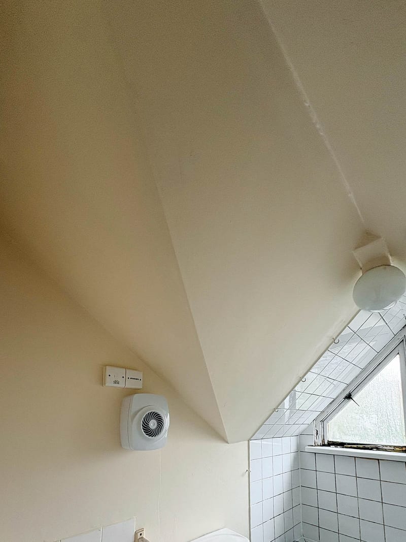 A bathroom ceiling in the same property, after the works