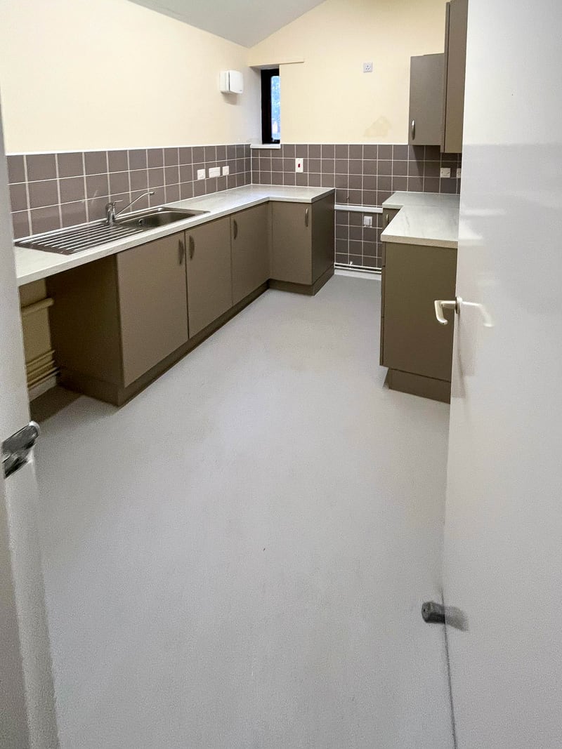 The kitchen of a social housing void, after the works